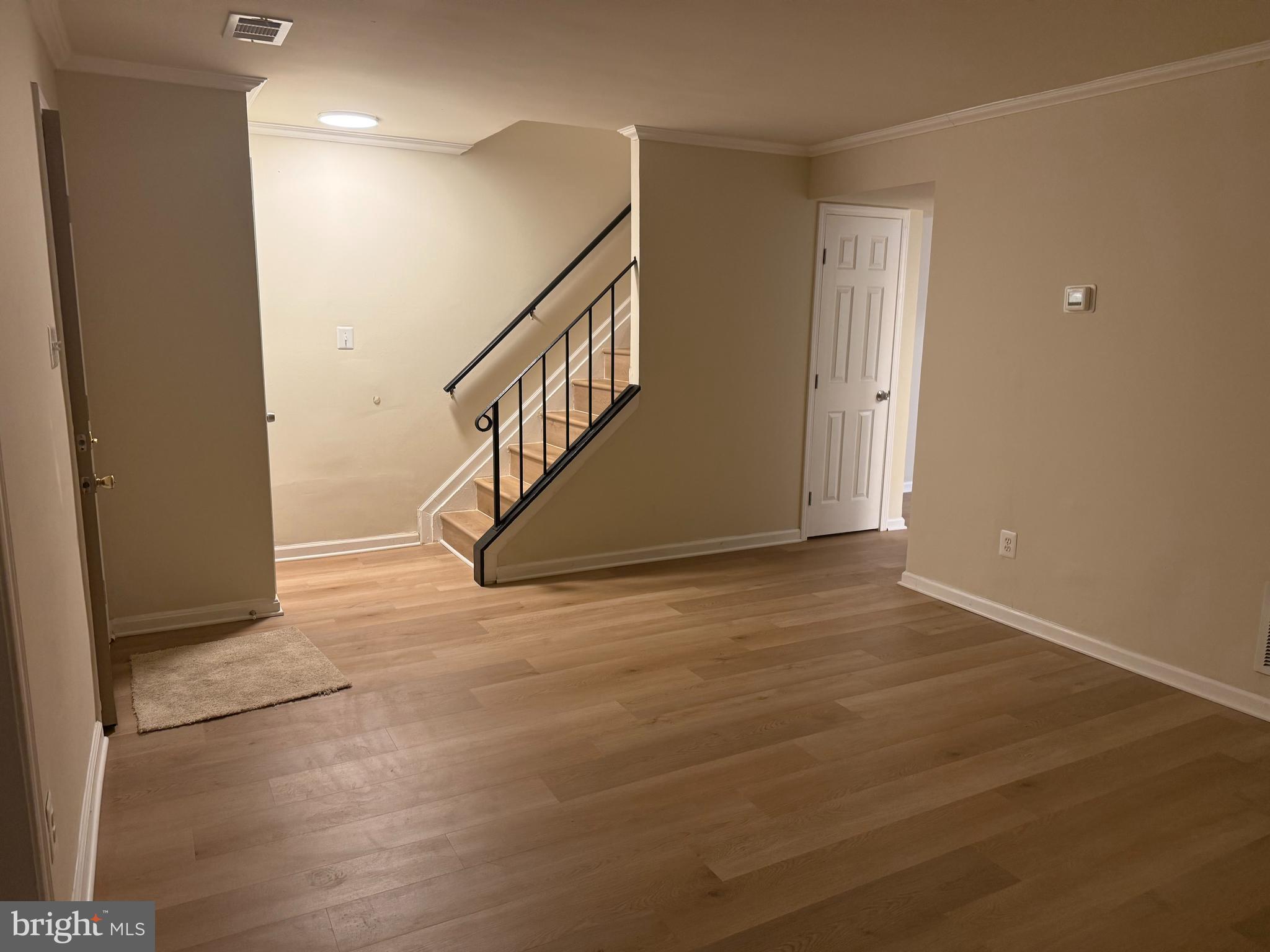 1287 Springtide Place Herndon, VA 20170 - Photo 4 of 23 a view of entryway and hall with wooden floor