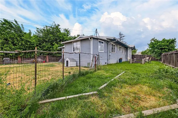 a view of a house with more windows and plants
