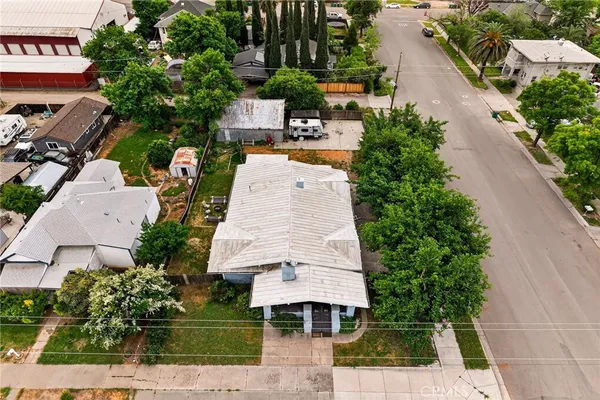 an aerial view of residential houses with outdoor space