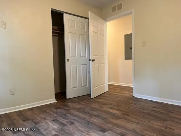 a view of wooden floor in an empty room