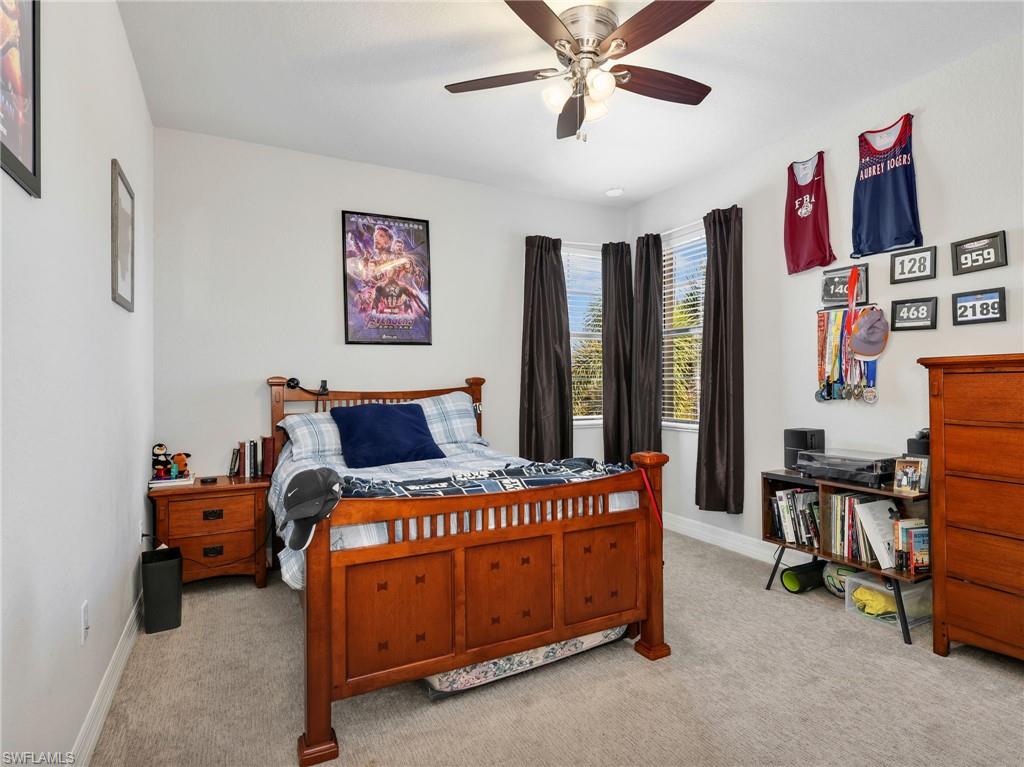 2756 Crystal Way Naples, FL 34119 - Photo 38 of 50 a bedroom with furniture and windows