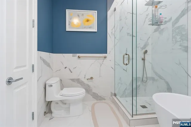 a white bath tub sitting in a bathroom