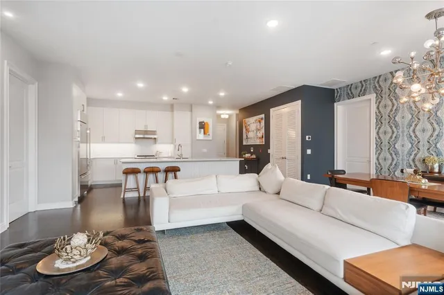 a bedroom with a bed dresser and a window