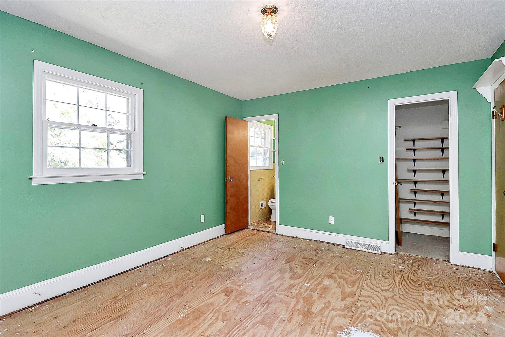 9811 Hannon Road Mint Hill, NC 28227 - Photo 17 of 27 an empty room with furniture and a window