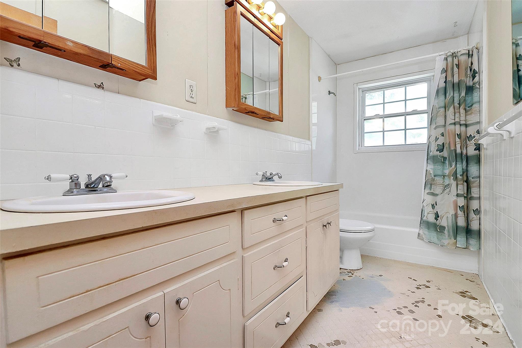 9811 Hannon Road Mint Hill, NC 28227 - Photo 19 of 27 a spacious bathroom with double vanity a toilet a and a window
