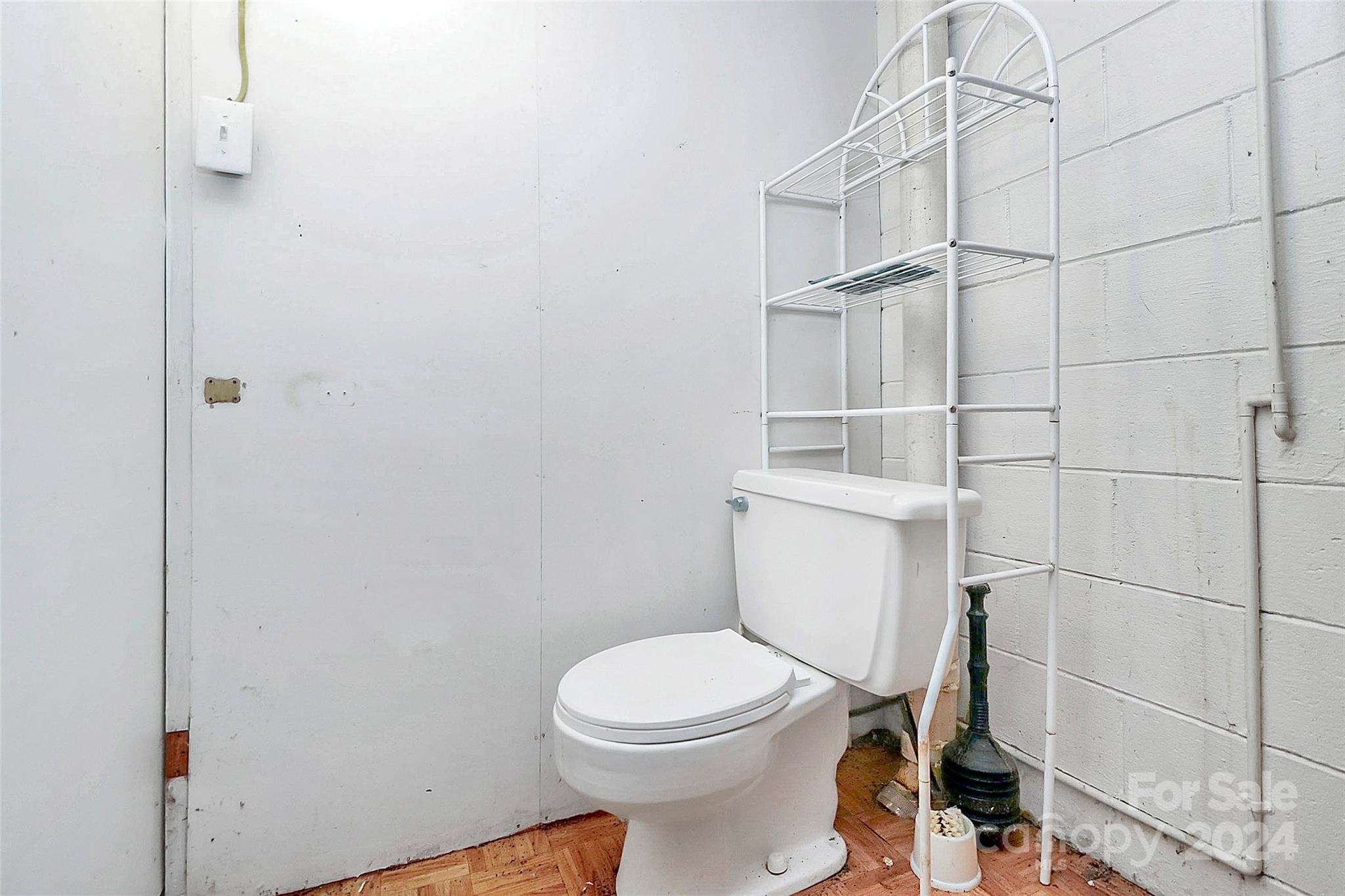 9811 Hannon Road Mint Hill, NC 28227 - Photo 23 of 27 a white toilet sitting next to a bathroom sink