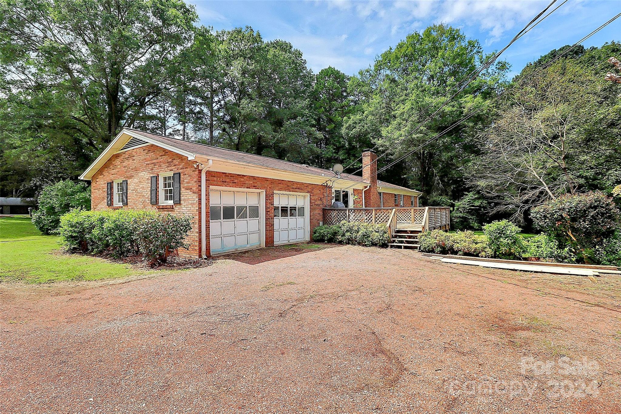 9811 Hannon Road Mint Hill, NC 28227 - Photo 3 of 27 a front view of a house with a garden