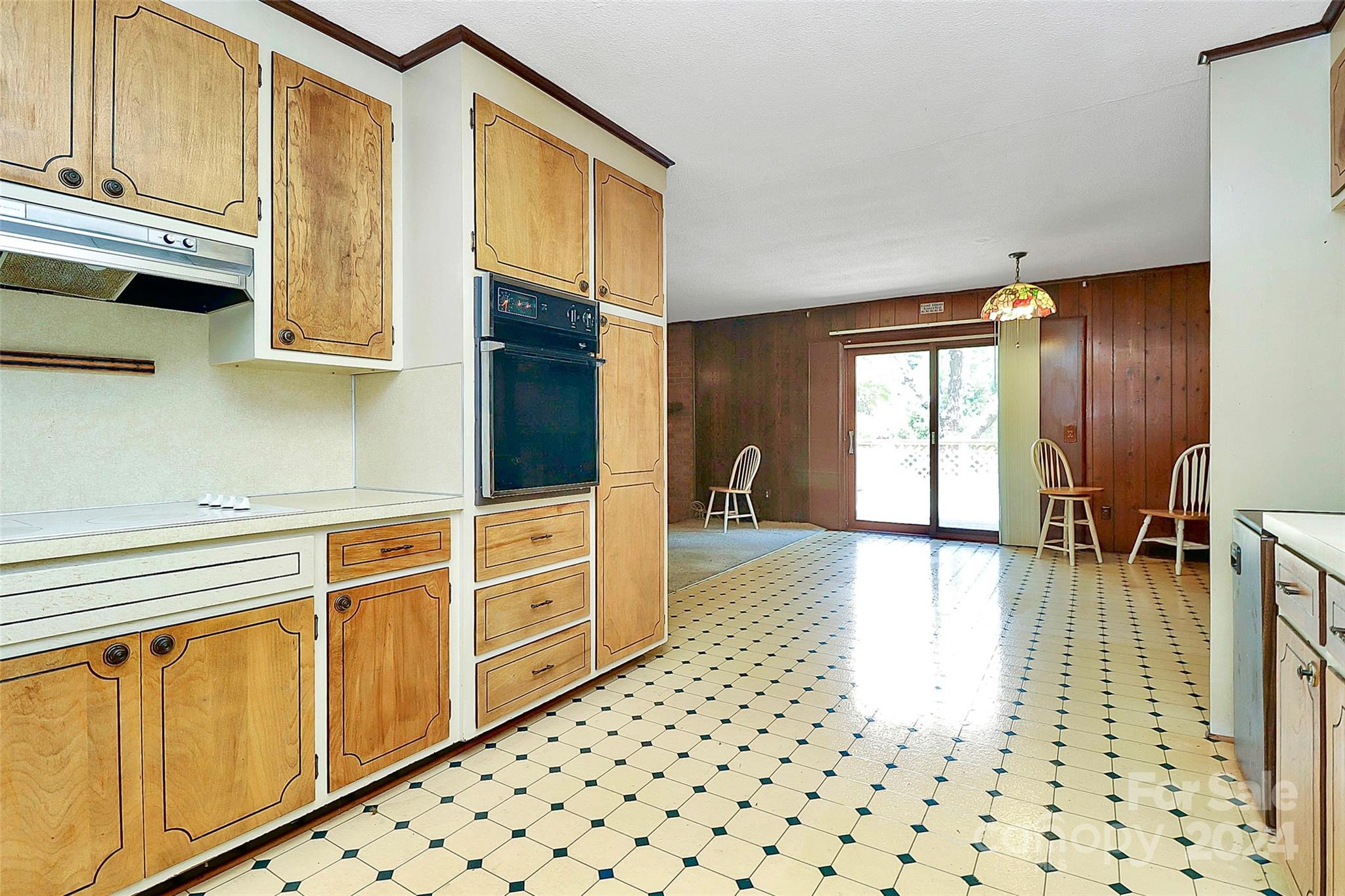 9811 Hannon Road Mint Hill, NC 28227 - Photo 9 of 27 a hallway with wooden cabinets and furniture