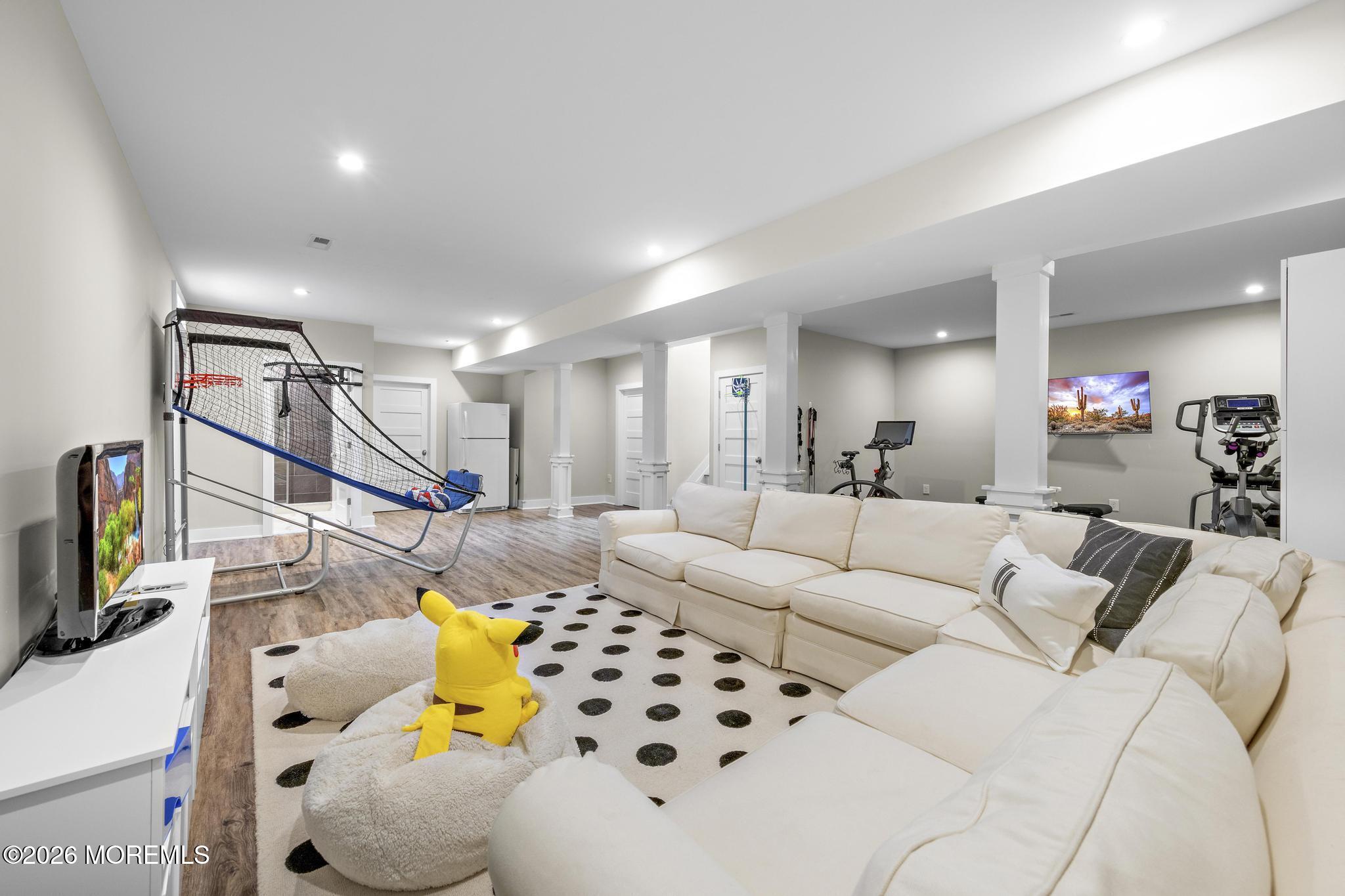 90 Washington Street Rumson, NJ 07760 - Photo 17 of 31 a living room with furniture and a flat screen tv