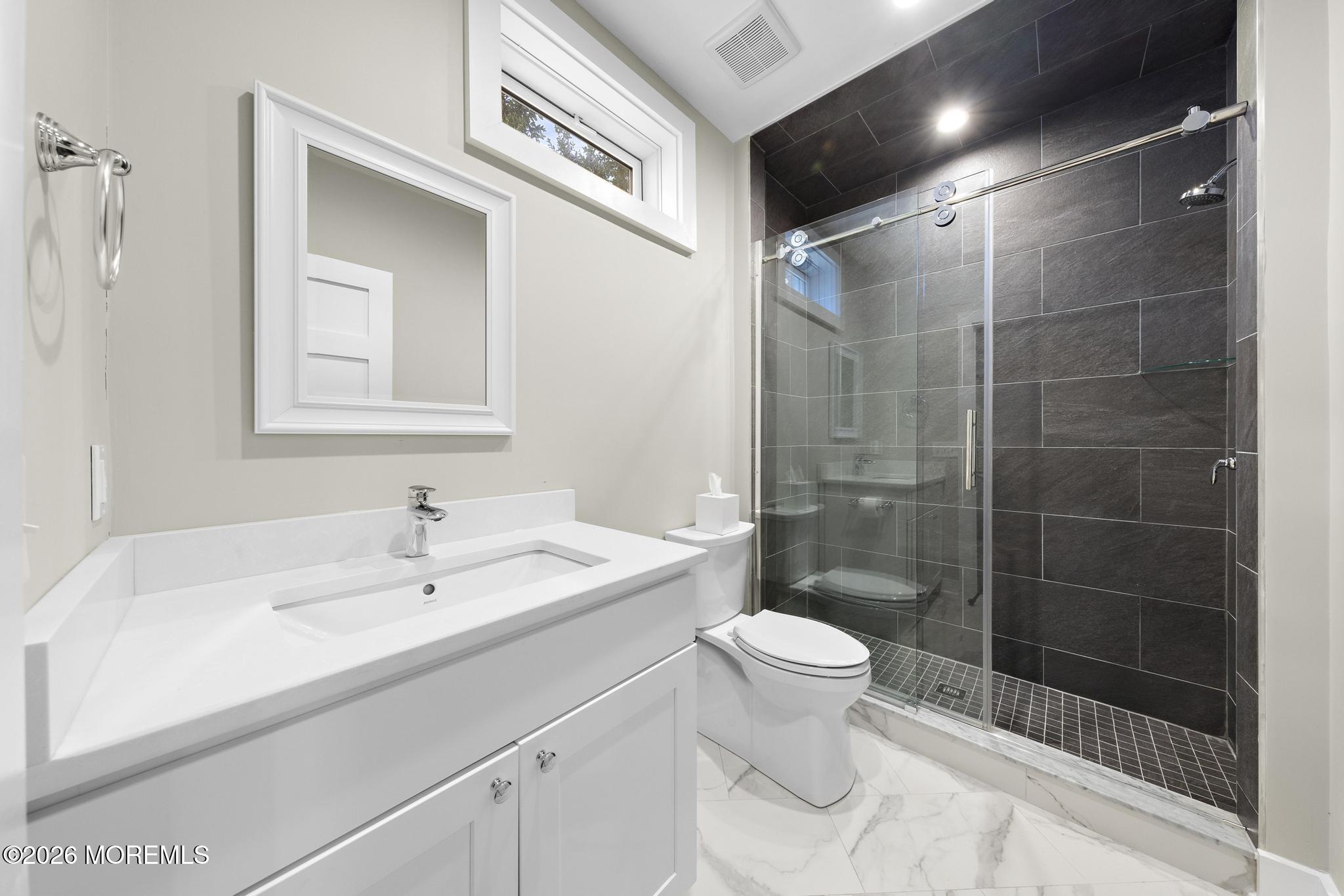 90 Washington Street Rumson, NJ 07760 - Photo 19 of 31 a bathroom with a sink a toilet and shower