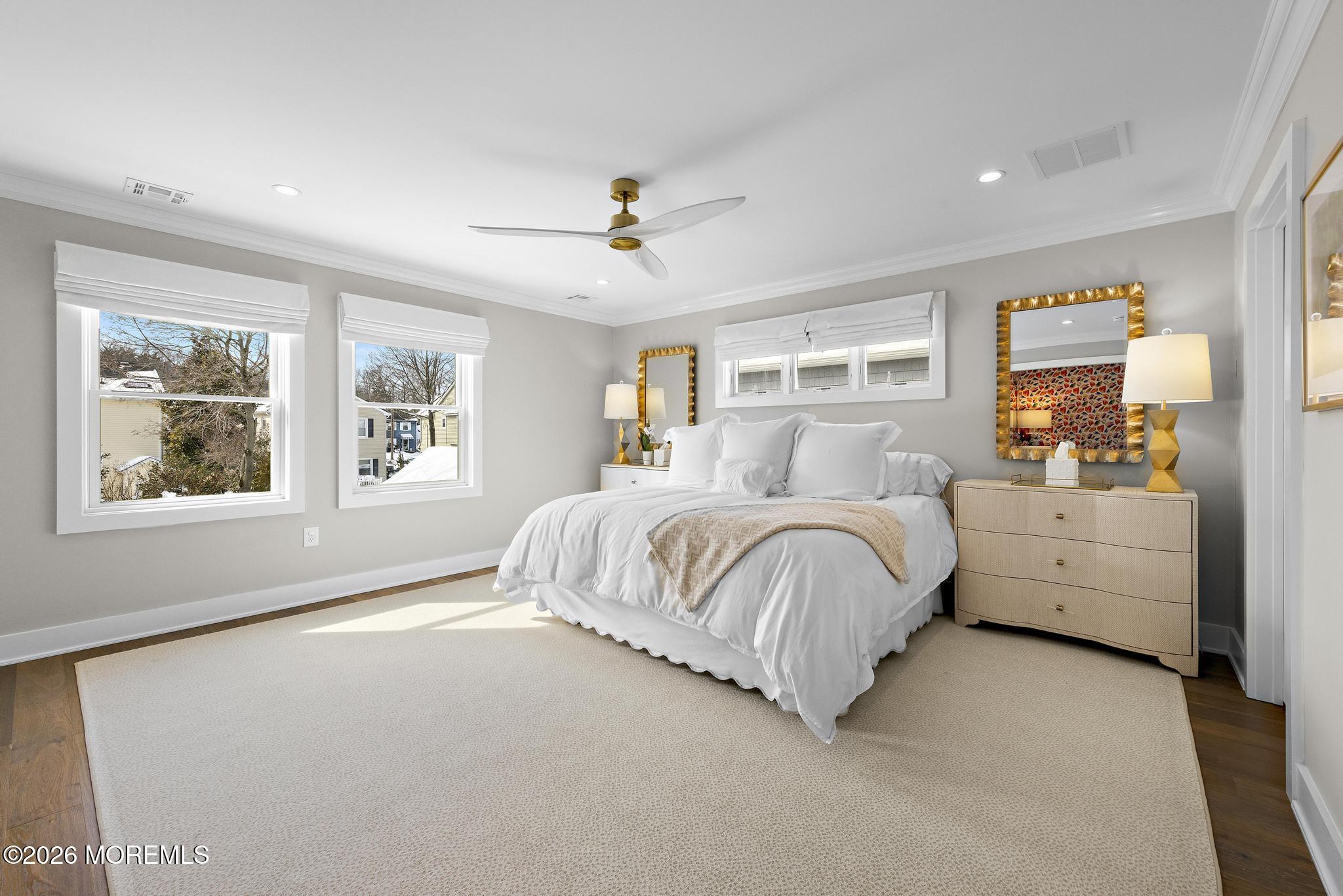 90 Washington Street Rumson, NJ 07760 - Photo 21 of 31 a spacious bedroom with a large bed and a window