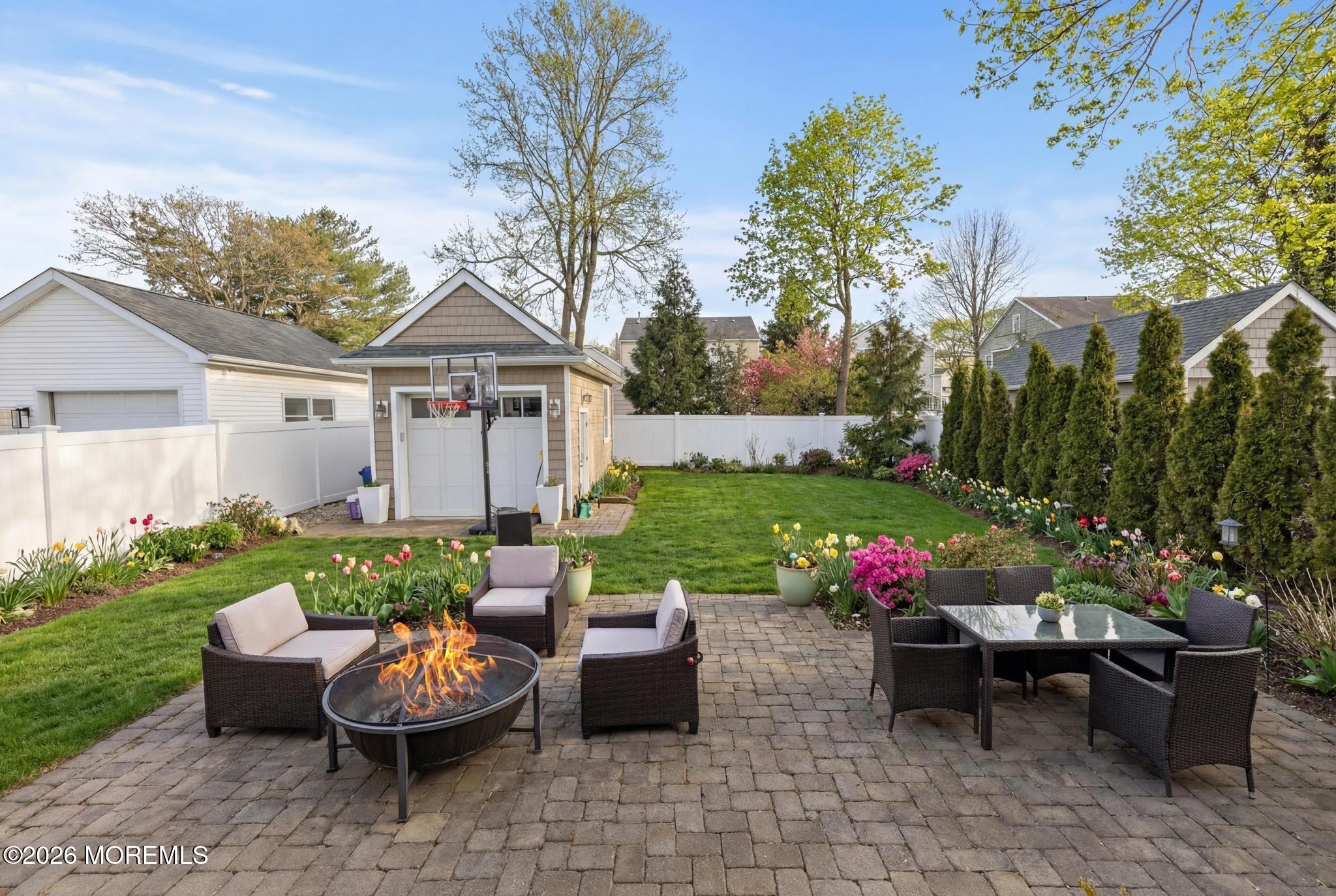 90 Washington Street Rumson, NJ 07760 - Photo 21 of 31 a view of a patio with furniture and a garden