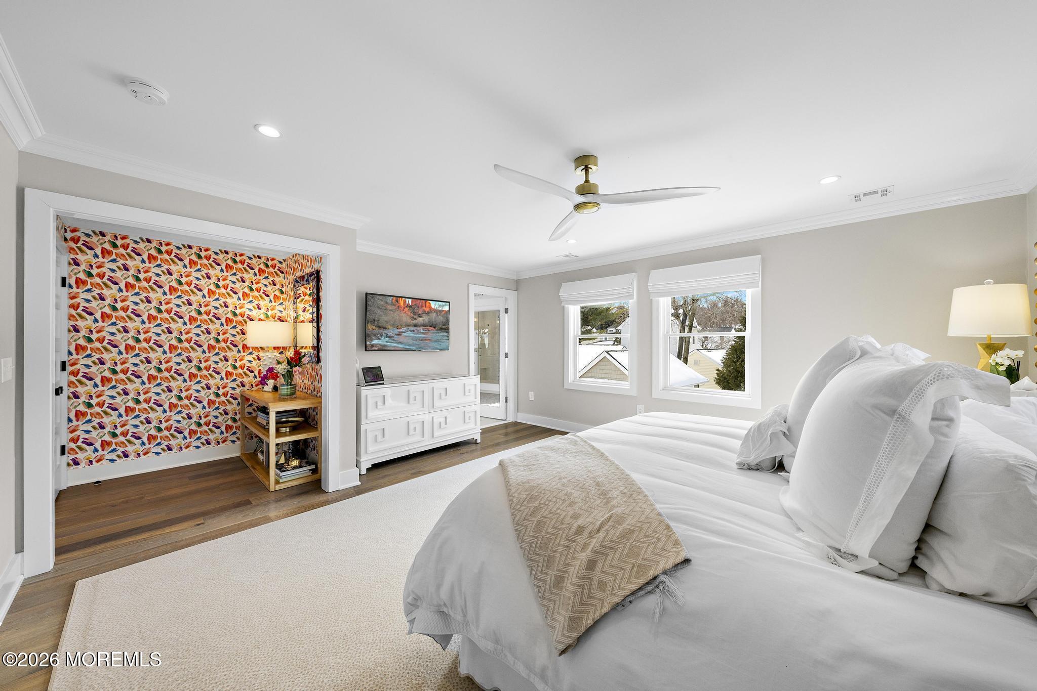 90 Washington Street Rumson, NJ 07760 - Photo 22 of 31 a spacious bedroom with a bed and a walk in closet