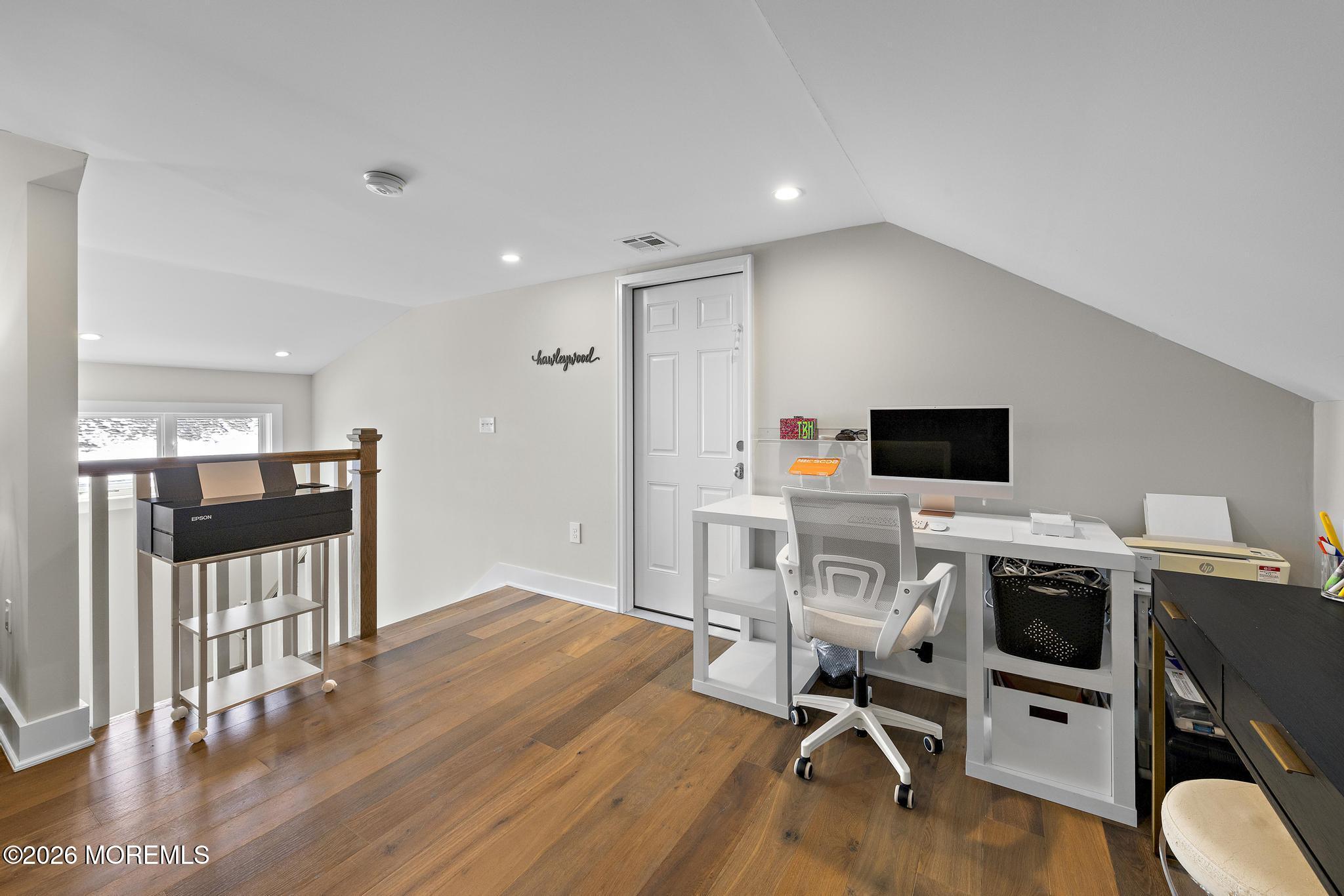 90 Washington Street Rumson, NJ 07760 - Photo 25 of 31 a view of a workspace with wooden floor and white cabinet