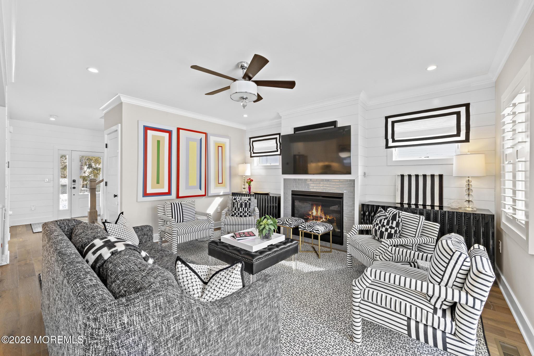 90 Washington Street Rumson, NJ 07760 - Photo 30 of 31 a living room with furniture a fireplace and a flat screen tv