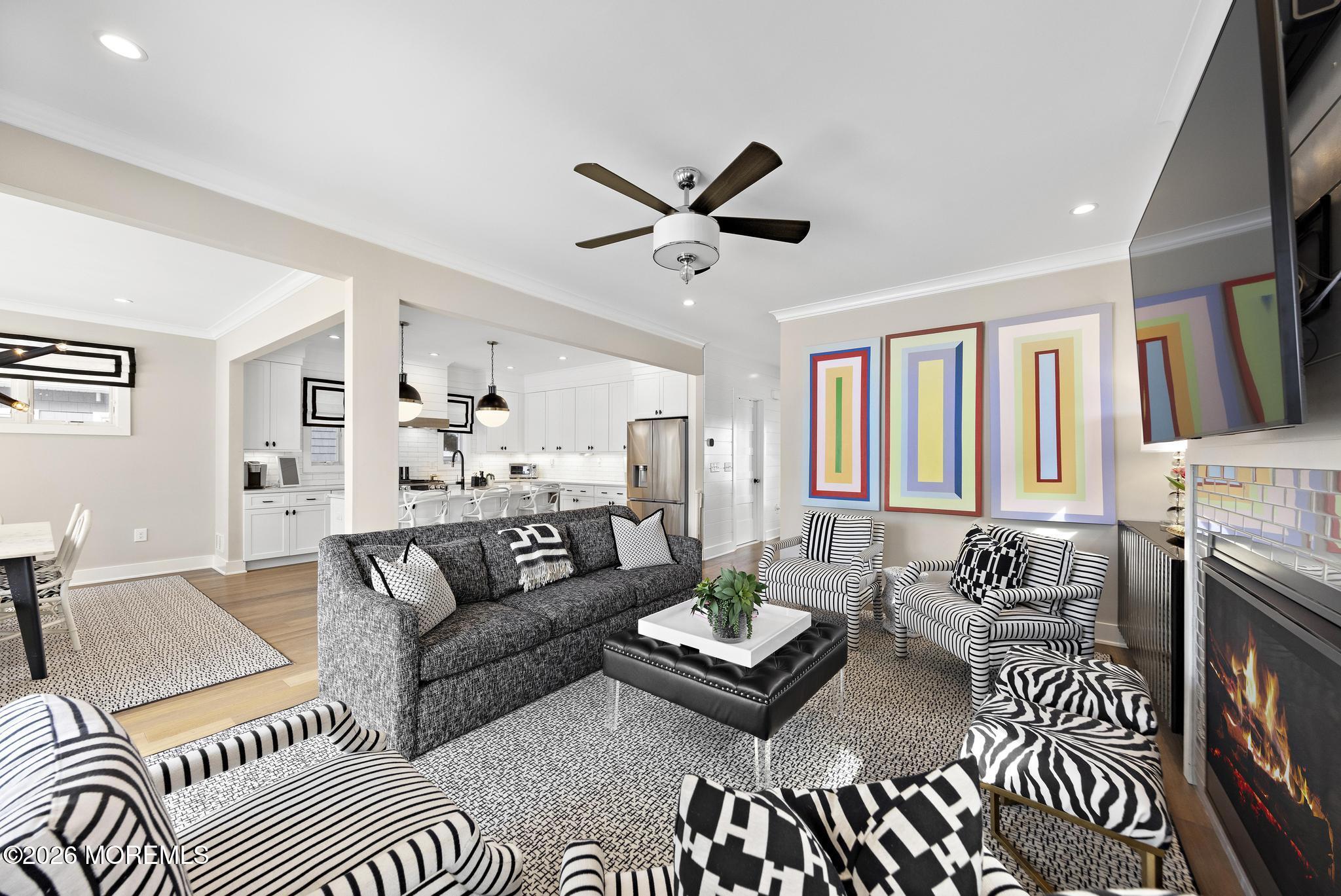 90 Washington Street Rumson, NJ 07760 - Photo 31 of 31 a living room with furniture fireplace and a flat screen tv