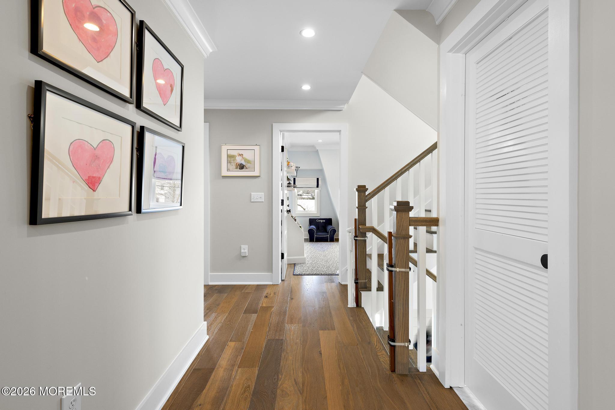 90 Washington Street Rumson, NJ 07760 - Photo 5 of 31 a view of a hallway with wooden floor and stairs