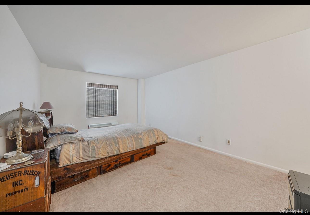 360 Shore Road, Unit 4B Long Beach, NY 11561 - Photo 22 of 28 Bedroom with carpet flooring and baseboards