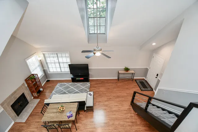 a view of a street with wooden fence