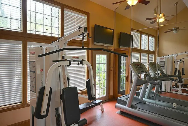 a view of a hall with couch and a fireplace