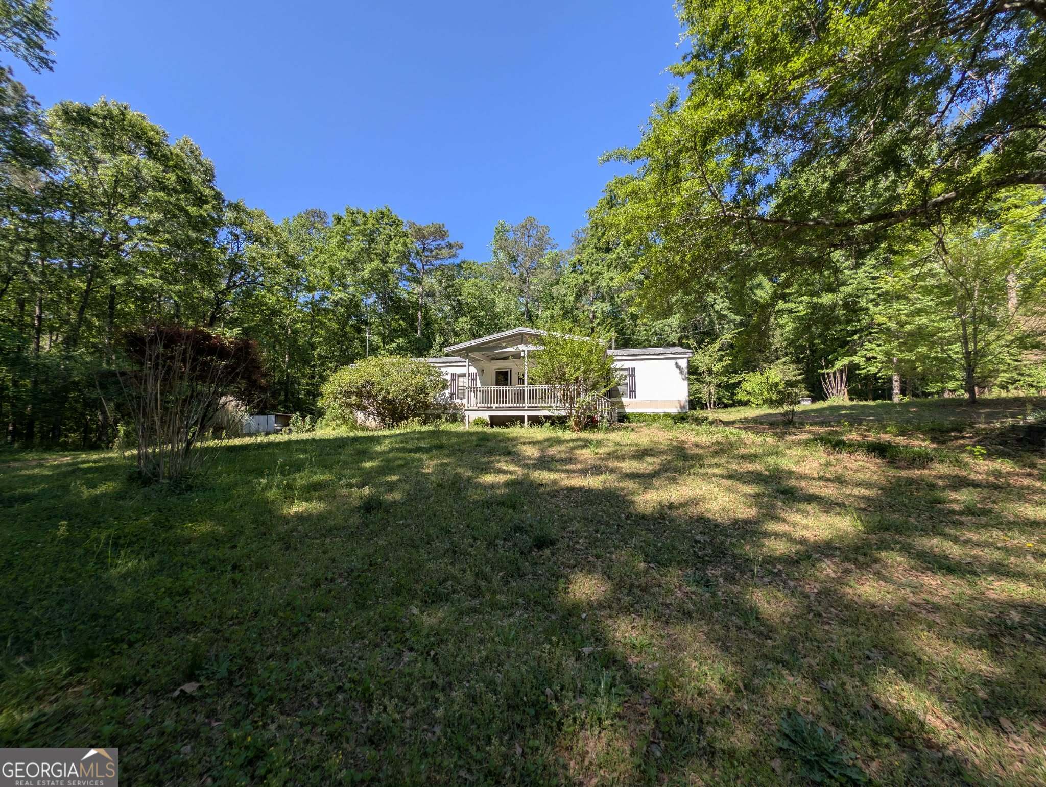 460 Etheridge Mill Road Milner, GA 30257 - Photo 1 of 27 a view of a house with a yard