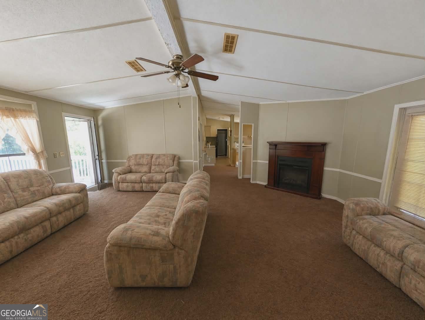 460 Etheridge Mill Road Milner, GA 30257 - Photo 5 of 27 a living room with furniture and a couch