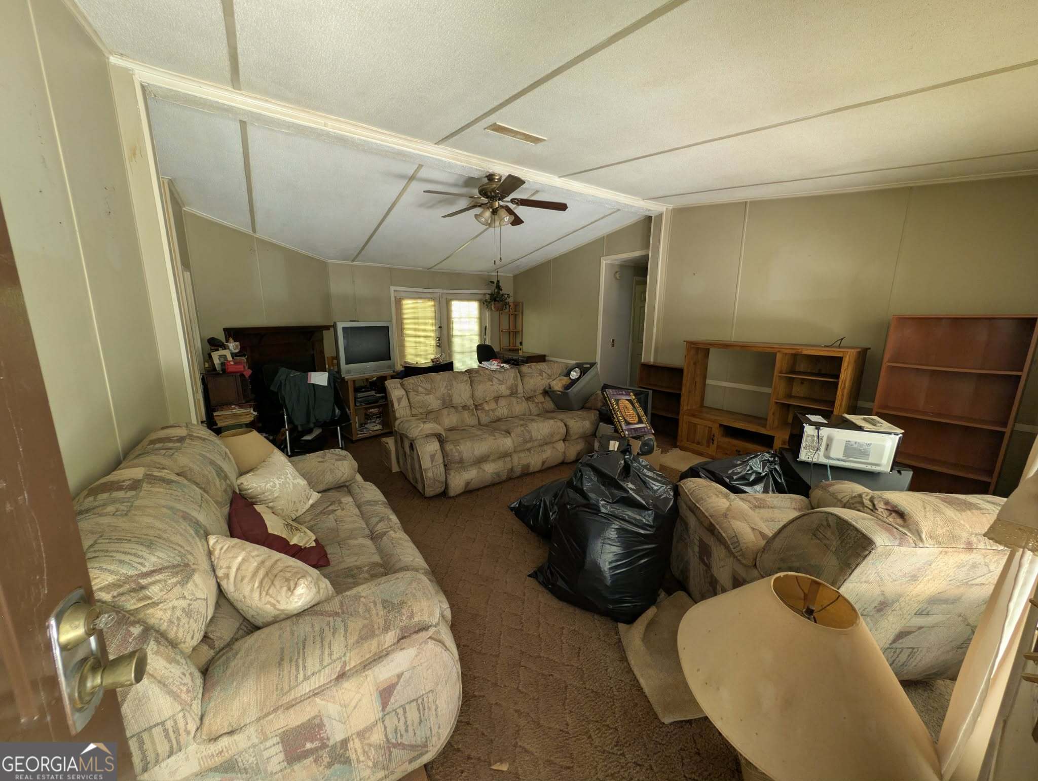 460 Etheridge Mill Road Milner, GA 30257 - Photo 7 of 27 a living room with furniture