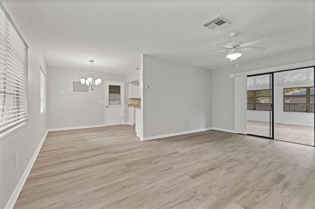 410 Daisy Lane Inverness, FL 34452 - Photo 12 of 37 a view of an empty room with glass door and windows
