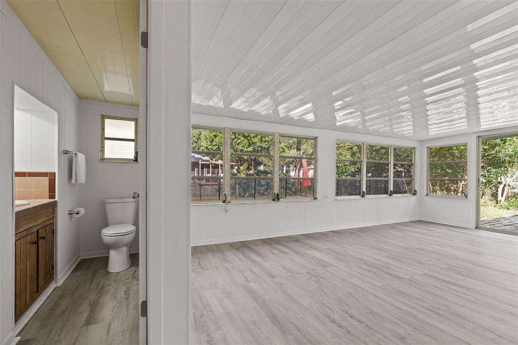 410 Daisy Lane Inverness, FL 34452 - Photo 20 of 37 a view of a room with a large window and wooden floor