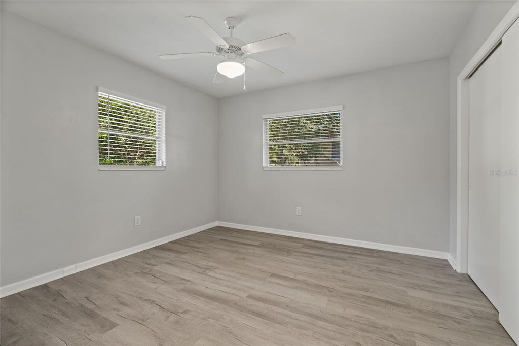 410 Daisy Lane Inverness, FL 34452 - Photo 26 of 37 wooden floor in an empty room with a window