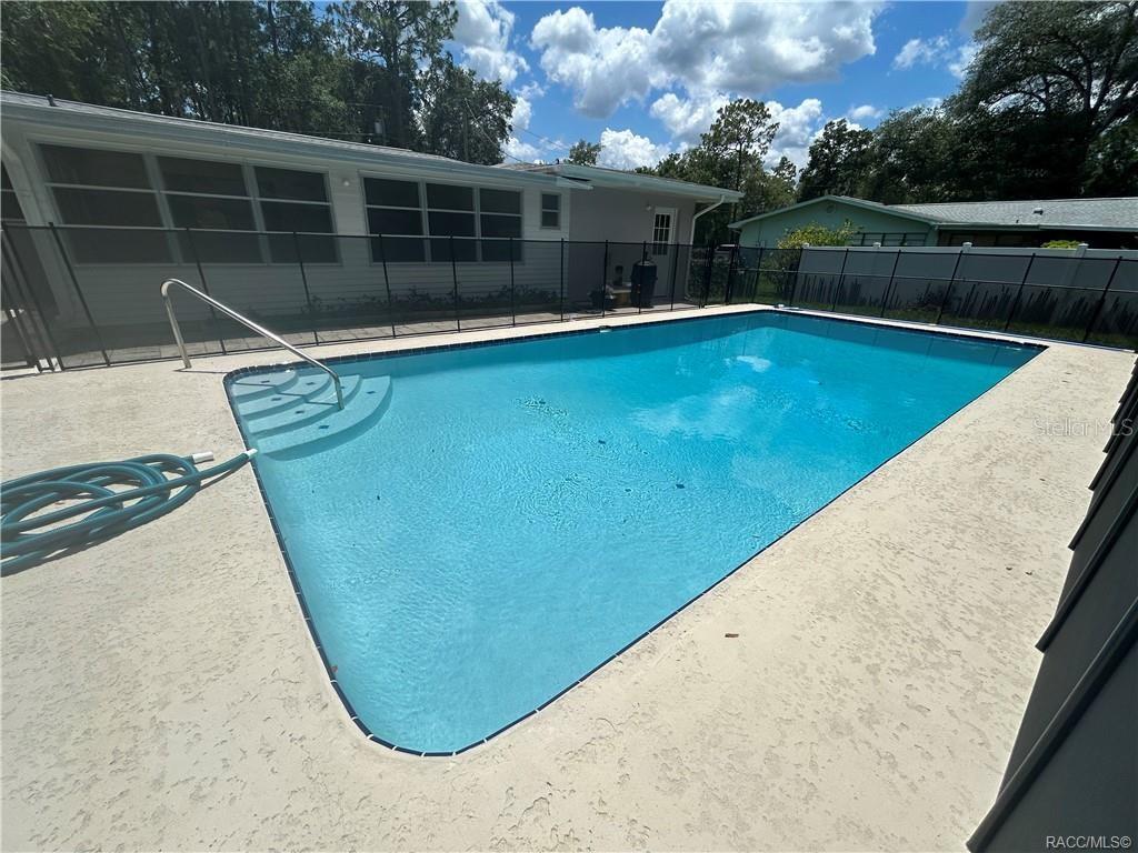 410 Daisy Lane Inverness, FL 34452 - Photo 31 of 37 a view of a swimming pool with a backyard