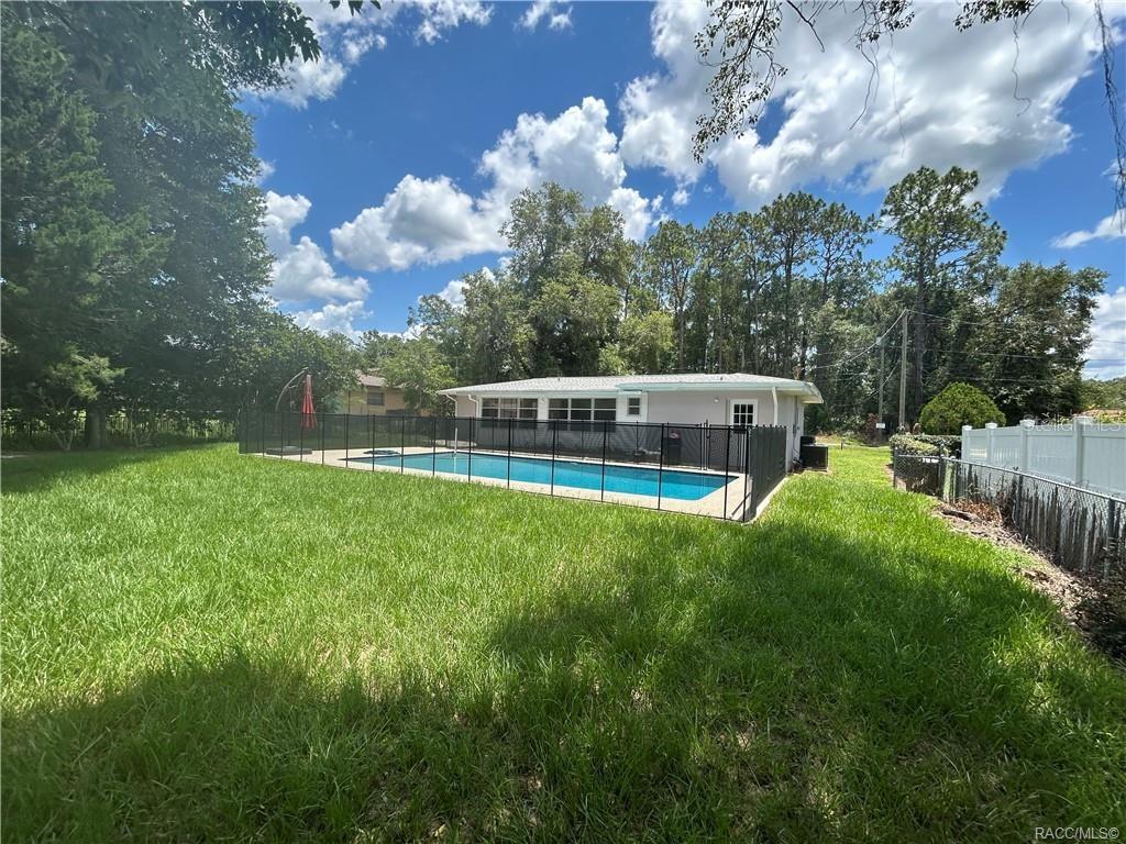 410 Daisy Lane Inverness, FL 34452 - Photo 32 of 37 a view of a house with backyard and garden