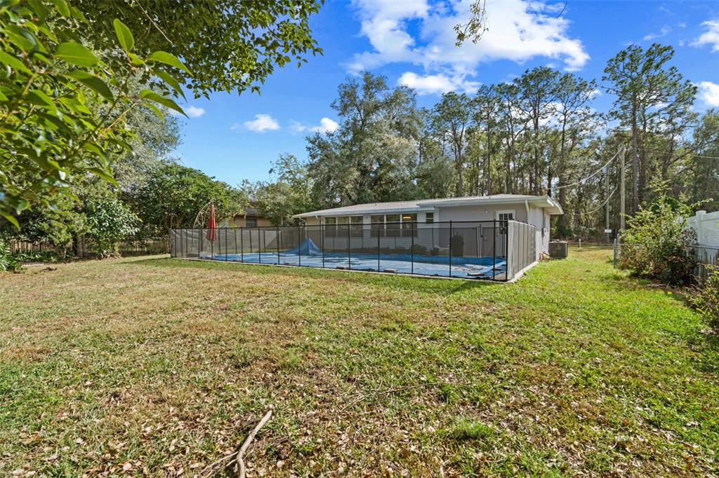 410 Daisy Lane Inverness, FL 34452 - Photo 8 of 37 a view of a house with a yard