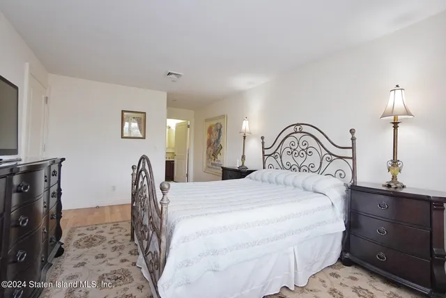 a bedroom with double bed and a window