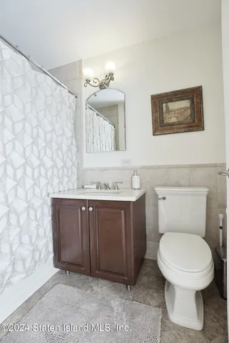 a bathroom with a toilet and a sink