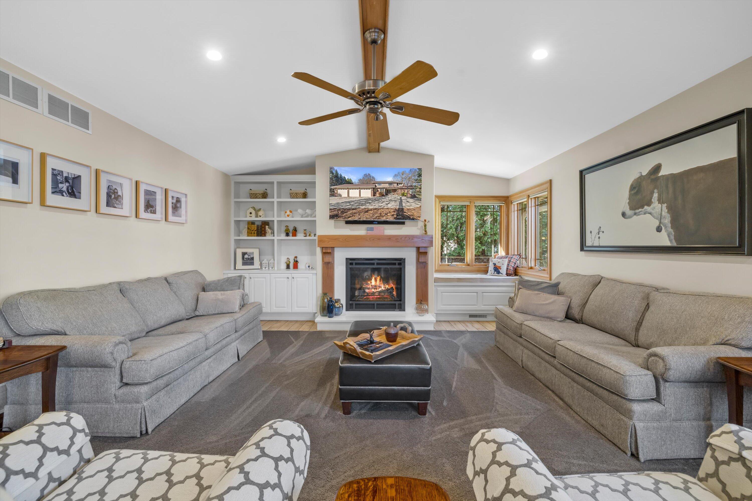 8400 122nd Street Pleasant Prairie, WI 53158 - Photo 11 of 78 Living Room with remote controlled fireplace, vaulted ceilings and beautiful built-in cabinets