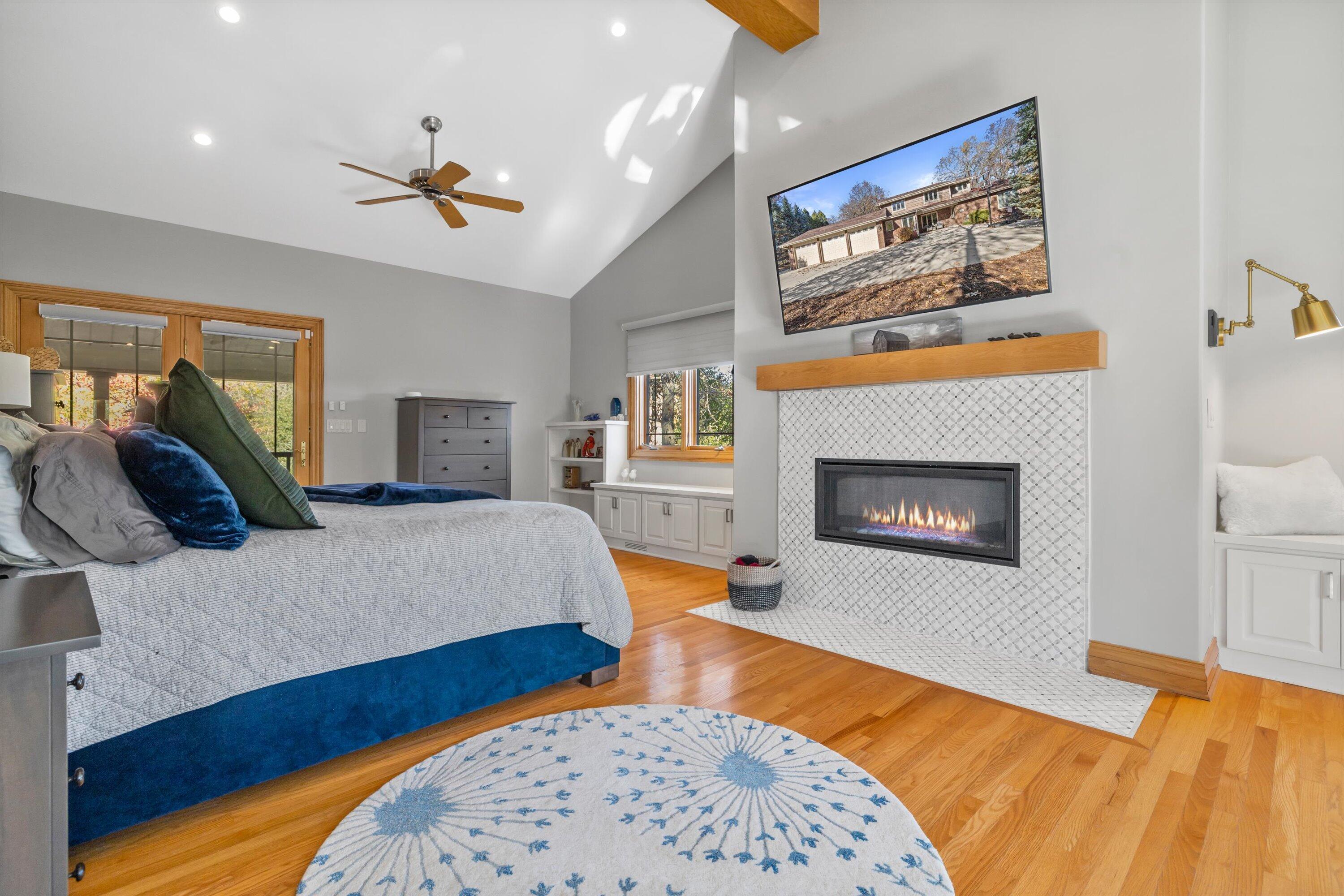 8400 122nd Street Pleasant Prairie, WI 53158 - Photo 15 of 78 Mastersuite remote controlled fireplace, hard wood floors, gorgeous built-ins