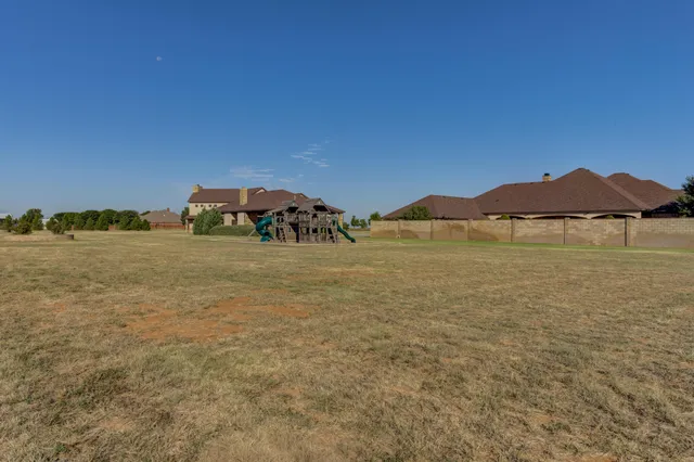 a bedroom with a bed and a mirror