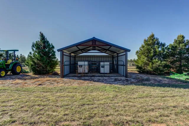 a spacious bathroom with a granite countertop sink and a mirror