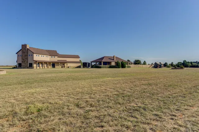 a en suite bathroom with a tub sink and mirror