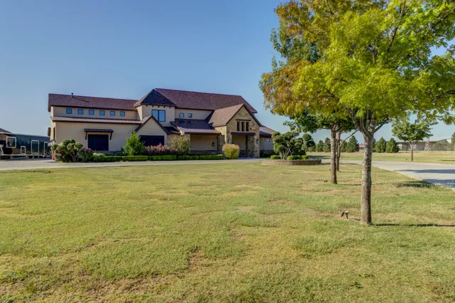 a living room with furniture ceiling fan and a window