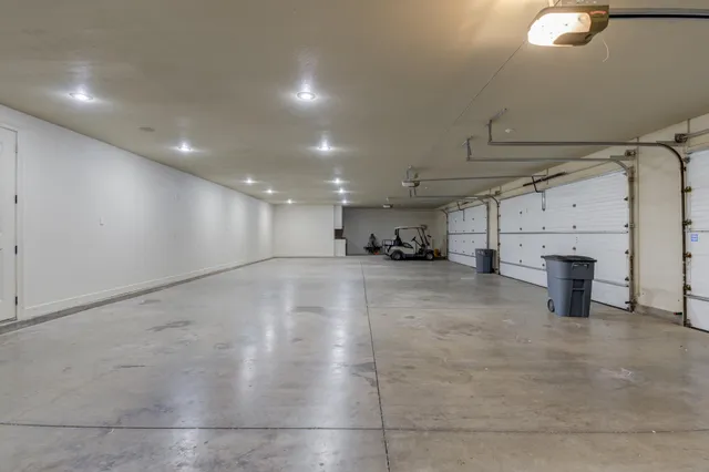 a kitchen with granite countertop a stove a sink and a wooden cabinets