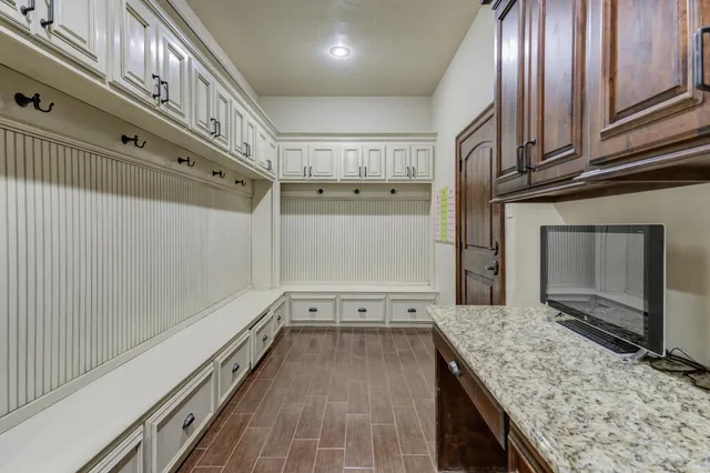 a kitchen with stainless steel appliances granite countertop a sink and a stove
