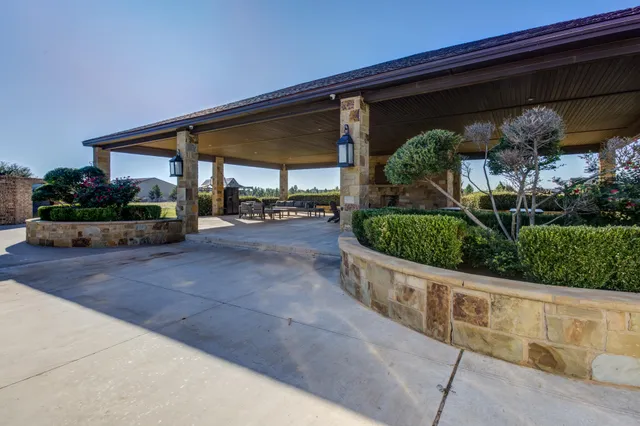 a bathroom with a sink and mirror with toilet