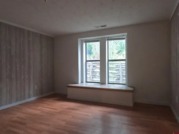 a view of an empty room with a window
