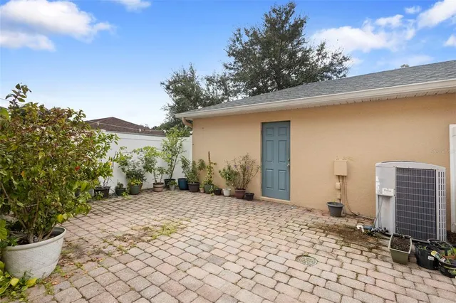 a view of a back yard with flower plants
