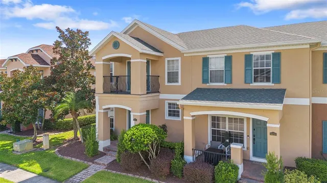 an aerial view of house with outdoor space and lake view