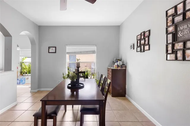 a spacious bedroom with a bed and a chandelier