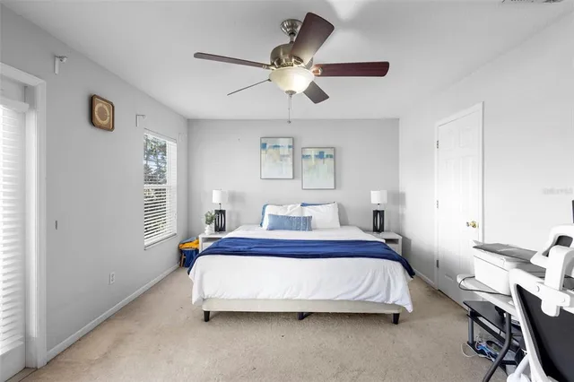 a view of a livingroom with workspace and a window