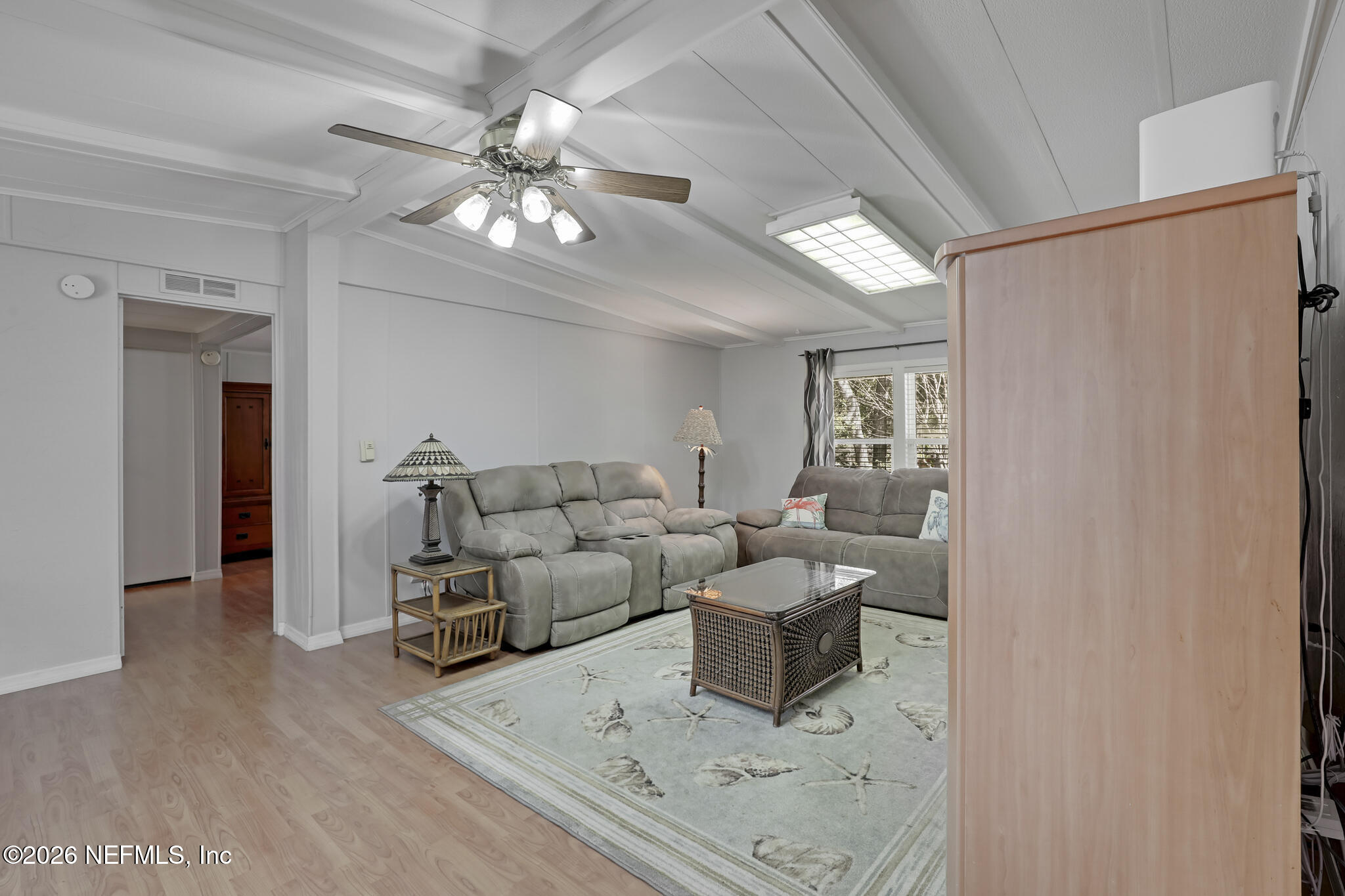6901 Catlett Road St. Augustine, FL 32095 - Photo 17 of 74 a living room with furniture and a chandelier